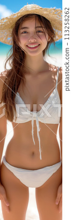 Woman in swimsuit and straw hat smiling on the beach, super vertical image Woman in swimsuit and straw hat smiling on the beach, super vertical image 113258262