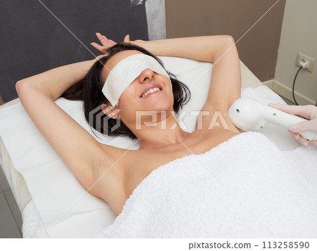 Beautician Removing Hair under armpit Beautician Removing Hair under armpit 113258590