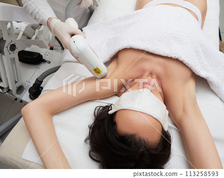 Beautician Removing Hair under armpit Beautician Removing Hair under armpit 113258593
