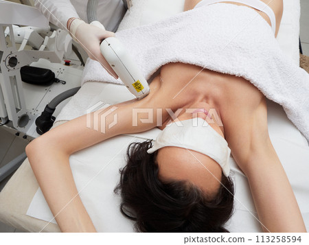 Beautician Removing Hair under armpit Beautician Removing Hair under armpit 113258594