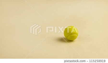 Candy in the form of a yellow tennis ball. Candy in the form of a yellow tennis ball. 113258919