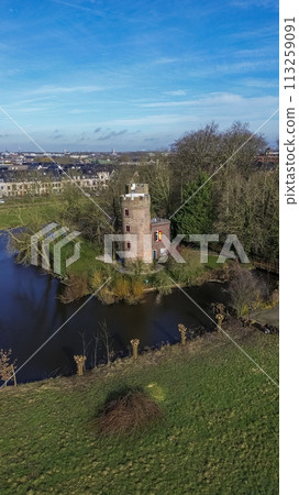 Schonauwen Castle, locally known as Kasteel Schonauwen in the province of Utrecht in the Netherlands. Beautiful view from above. Beautiful Dutch canals are filled with water. Schonauwen Castle, locally known as Kasteel Schonauwen in the province of Utrecht in the Netherlands. Beautiful view from above. Beautiful Dutch canals are filled with water. 113259091