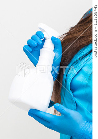 Hand holding antiseptic antibacterial disinfectant isolated on white background Hand holding antiseptic antibacterial disinfectant isolated on white background 113259445