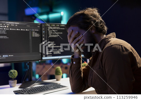 Troubled man facepalming himself while doing software quality assurance, finding major errors in source code. Depressed developer upset after inspecting coding on desktop PC and seeing many issues Troubled man facepalming himself while doing software quality assurance, finding major errors in source code. Depressed developer upset after inspecting coding on desktop PC and seeing many issues 113259946