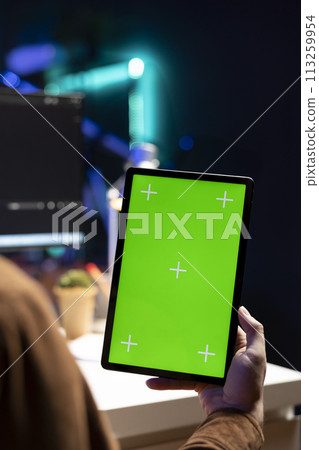 Cybersecurity expert using green screen tablet to secure company servers from virus attacks. IT remote employee writing code, building firewalls protecting data using mockup portable digital device 113259954