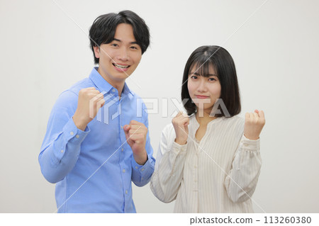 Fist pump with both hands_Men and women in casual clothes_1 113260380