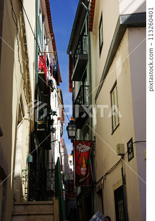 Narrow white-walled alleys of Lisbon's old town Narrow white-walled alleys of Lisbon's old town 113260401