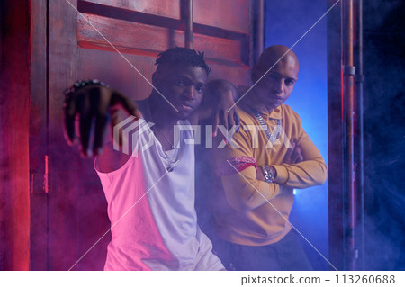 Two multiethnic teenagers boys indoors in abandoned building Two multiethnic teenagers boys indoors in abandoned building 113260688