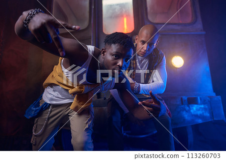 Group of cool emotional guys performing hip-hop style in underground Group of cool emotional guys performing hip-hop style in underground 113260703