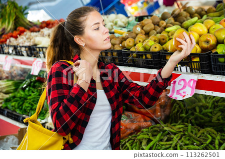 Portrait of nice young woman buying fresh apples 113262501