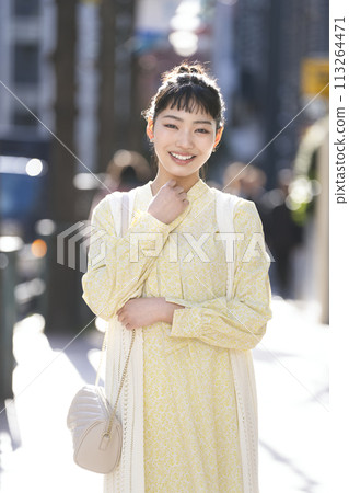 A young woman smiling looking at the camera A young woman smiling looking at the camera 113264471