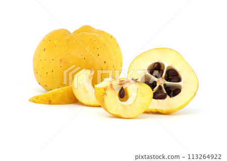 Halved quince with seeds visible over white background 113264922