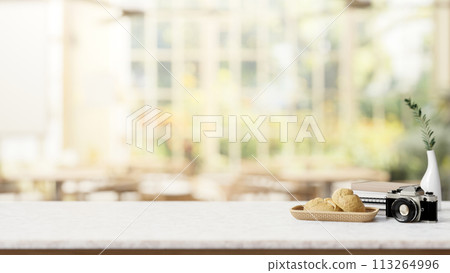A dining table in a restaurant or coffee shop with a view from a garden on a sunny day. A dining table in a restaurant or coffee shop with a view from a garden on a sunny day. 113264996
