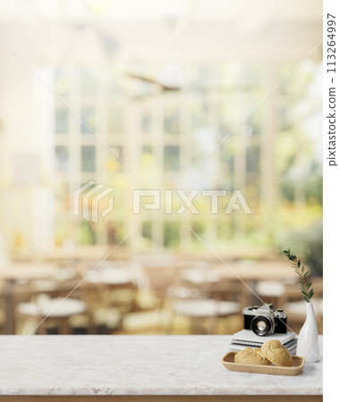 A dining table in a restaurant or coffee shop with a view from a garden on a sunny day. A dining table in a restaurant or coffee shop with a view from a garden on a sunny day. 113264997
