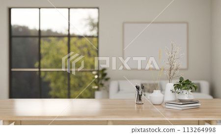A minimalist wooden table with a space to display products in a contemporary minimalist living room. A minimalist wooden table with a space to display products in a contemporary minimalist living room. 113264998