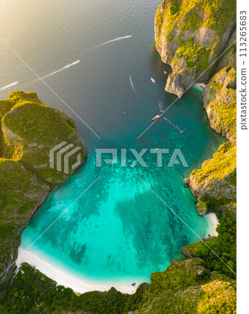 Aerial view of a tropical Maya bay beach with turquoise water and white sand Aerial view of a tropical Maya bay beach with turquoise water and white sand 113265683
