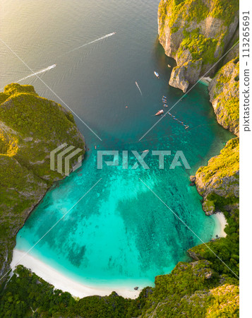 Aerial view of a tropical Maya bay beach with turquoise water and white sand 113265691