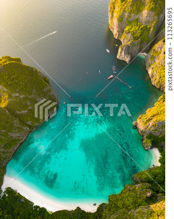 Aerial view of a tropical Maya bay beach with turquoise water and white sand Aerial view of a tropical Maya bay beach with turquoise water and white sand 113265695
