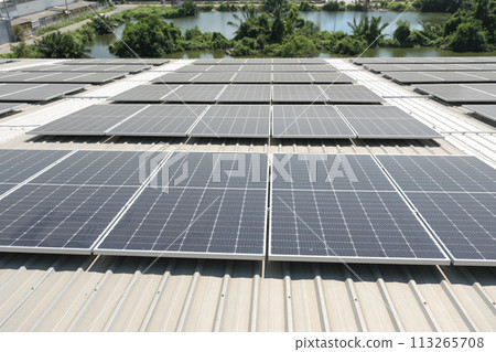 Engineers install solar cells on the roof of factory 113265708