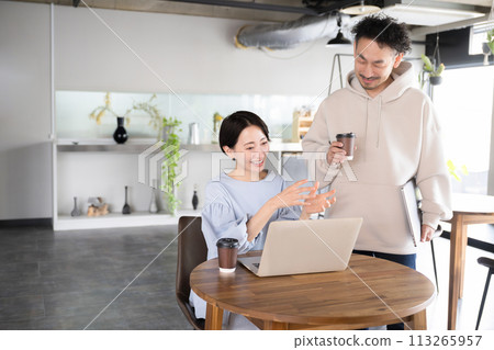 Business scene of men and women working side by side in a beautiful office Office casual company 113265957