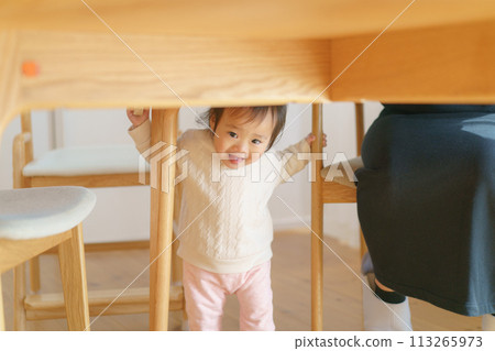 Baby under the table 113265973