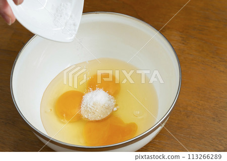 Tamagoyaki process: Mixing the eggs Tamagoyaki process: Mixing the eggs 113266289