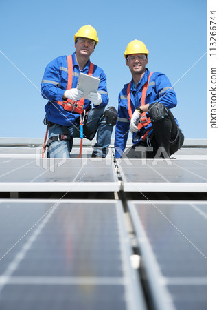 Team of engineers working at the factory 113266744