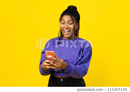 Woman Using Smartphone on Yellow Backgroung Woman Using Smartphone on Yellow Backgroung 113267130