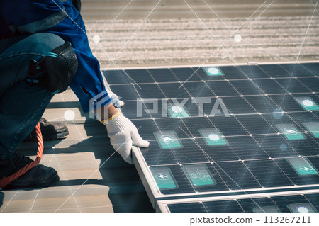 Engineers install solar cells on the roof of factory 113267211