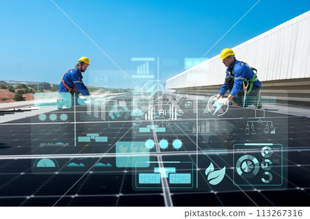 Engineers install solar cells on the roof of factory 113267316