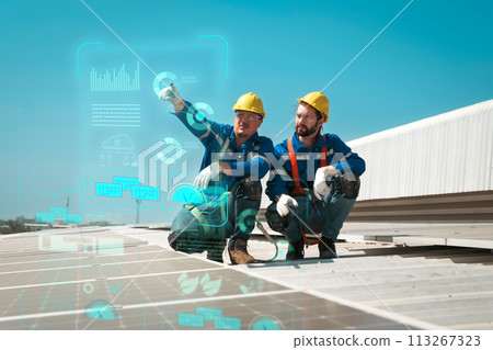 Engineers install solar cells on the roof of factory 113267323