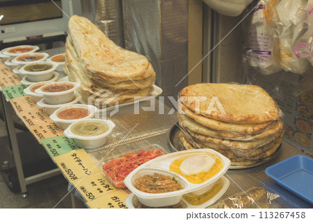 Indian curry and naan sold as a takeaway lunch box Indian curry and naan sold as a takeaway lunch box 113267458