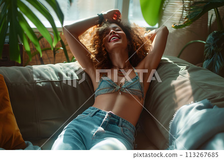 Intimate Melodies: Captivating Young Woman in Lingerie Dancing at Home 113267685