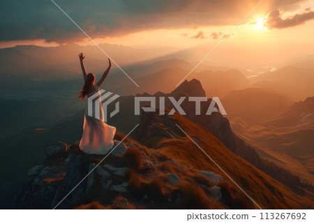 Summit Celebration: Woman Triumphantly Reaches Nature's Peak 113267692