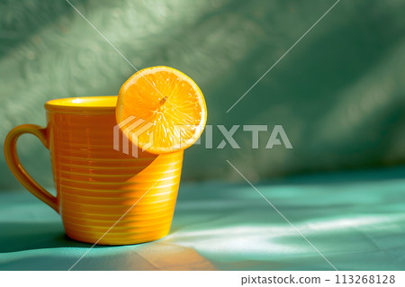 Sip of Sunshine: Fresh Orange Juice and Lemon Slice on Green Backdrop Sip of Sunshine: Fresh Orange Juice and Lemon Slice on Green Backdrop 113268128