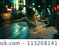 Mystical Moves: Enchanting Night Dance Performance by a Woman on Japan's Streets 113268141