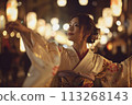 Mystical Moves: Enchanting Night Dance Performance by a Woman on Japan's Streets 113268143