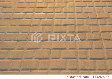 Stone yellow mosaic city street floor tile in sunny sunset light background texture Stone yellow mosaic city street floor tile in sunny sunset light background texture 113269253
