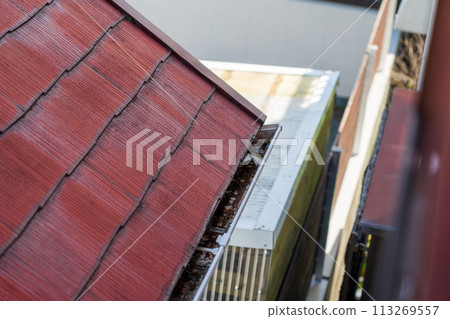 Rain gutter of an old folk house 113269557