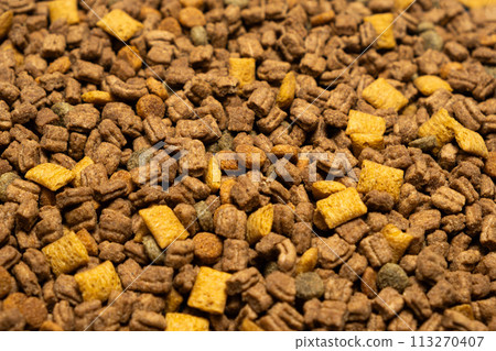Dry food for puppies close-up. Complete diet for dogs during their first year of life 113270407