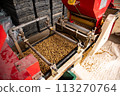Pouring water on the rice 113270764