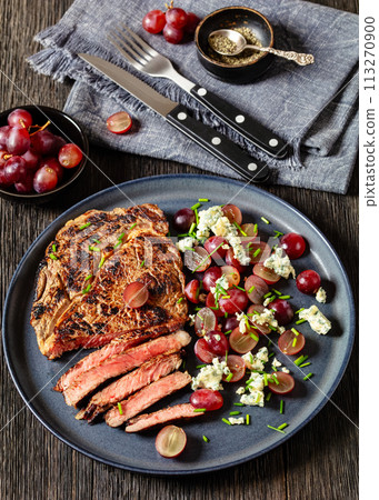 fried beef steak with salad of grape, cheese 113270900