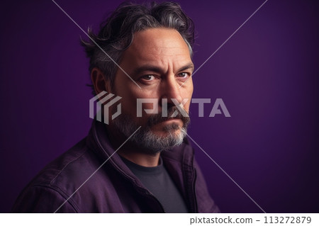 A man with a beard and gray hair is wearing a purple jacket A man with a beard and gray hair is wearing a purple jacket 113272879