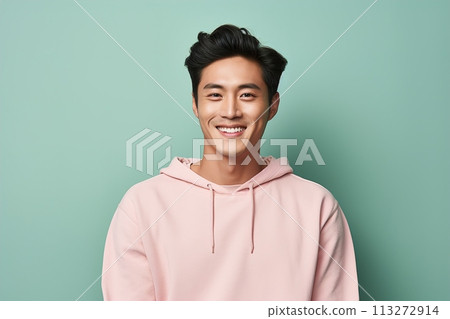 A man is smiling and wearing a pink hoodie 113272914