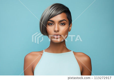 A woman with a short haircut and a blue tank top 113272917