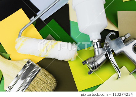 Paint spray gun at work at the workplace in the workshop. Paint Brush Paint spray gun at work at the workplace in the workshop. Paint Brush 113274234