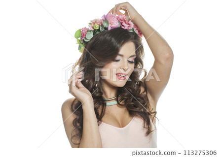 Good-looking young model with long curly hair, makeup and perfect healthy skin Good-looking young model with long curly hair, makeup and perfect healthy skin 113275306