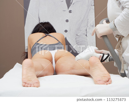 Beautician Removing Hair Beautician Removing Hair 113275873