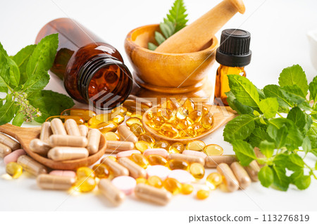 Alternative medicine herbal organic capsule with vitamin E omega 3 fish oil, mineral, drug with herbs leaf natural supplements for healthy good life. 113276819