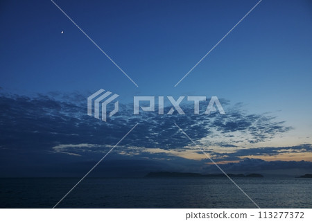 A crescent moon and a twilight sky with a variety of clouds, early summer, 230723pm 113277372